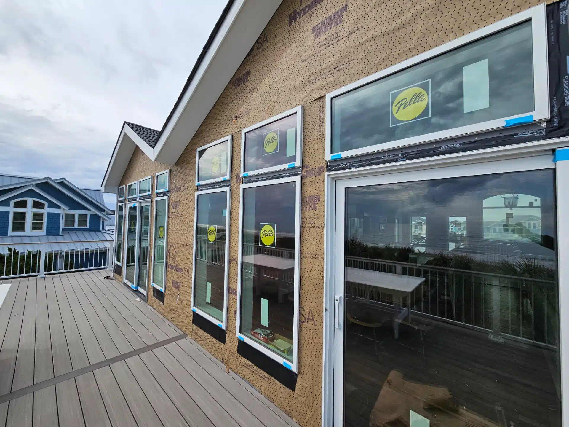 commercial-deck-with-railing-on-the-restaurant-with-multiple-windows-replacement-in-outer-banks-nc