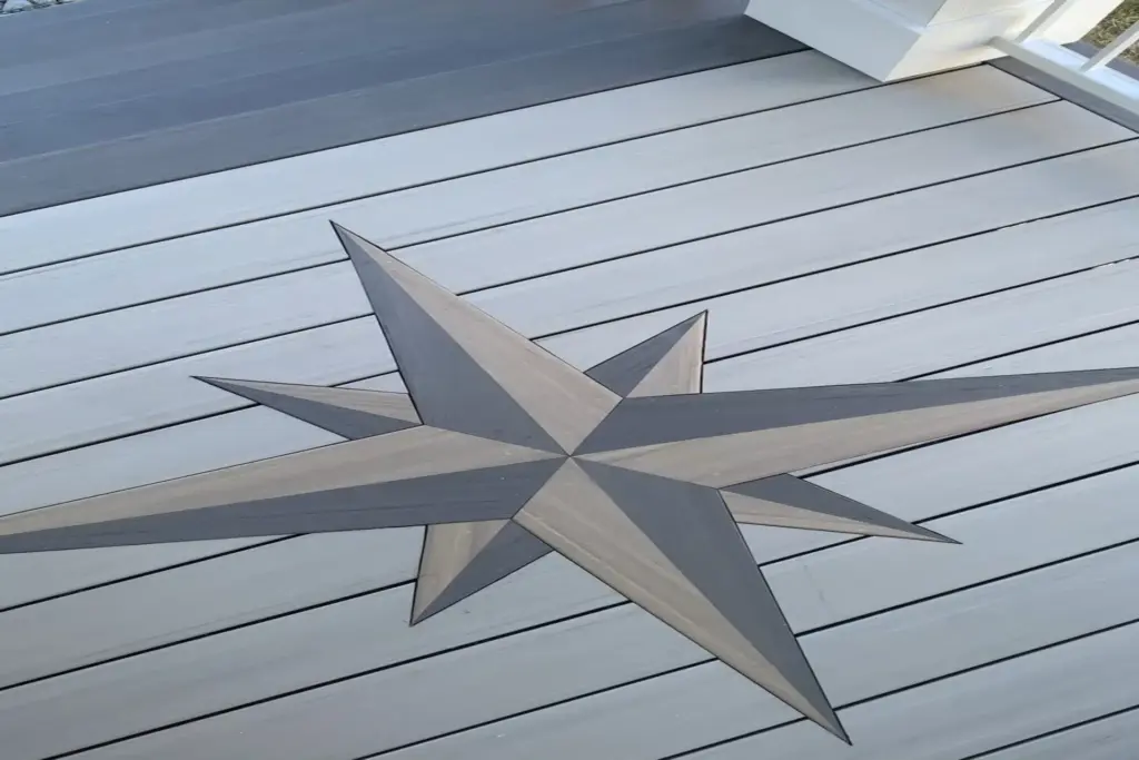 gray-deck-with-white-railing-with-design-on-it-in-outer-banks-nc