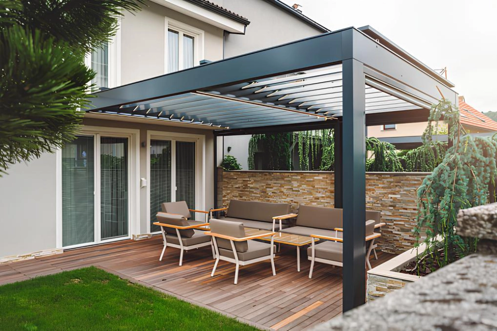 modern-louvered-pergola-attached-on-the-house-with-outdoor-living-area-featuring-brick-privacy-wall-in-outer-banks-nc