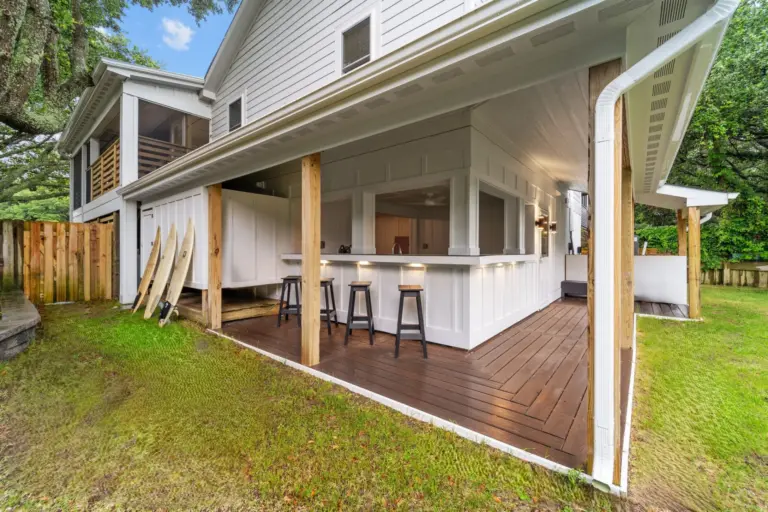 outdoor-living-bar-area-on-the-siding-of-the-house-with-three-surf-boards-and-a-wooden-gate-in-outer-banks-nc